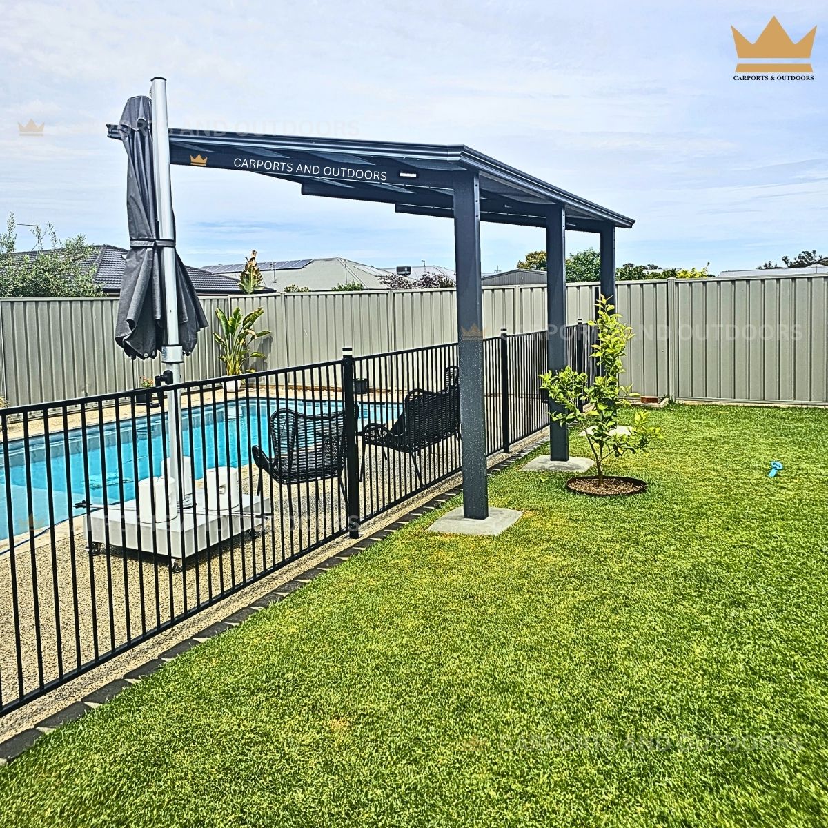 Aluminium Insulated Pergola with umbrella next to a pool in a backyard setting