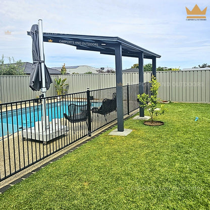 Aluminium Insulated Pergola with umbrella next to a pool in a backyard setting