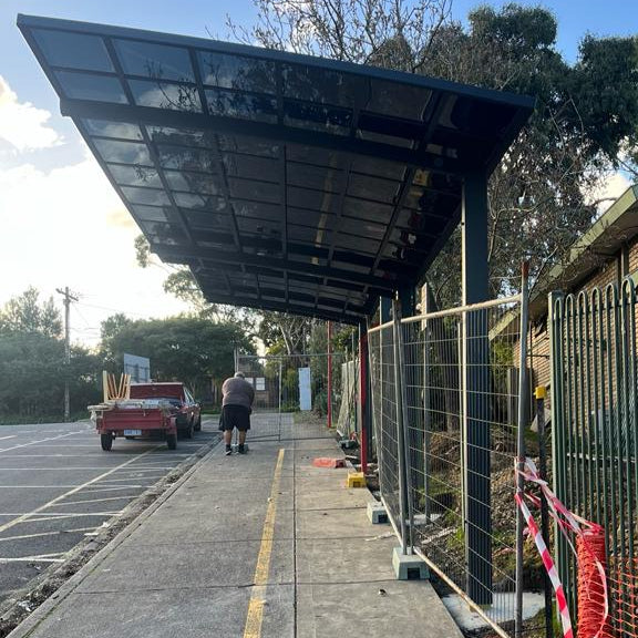 Cantilever carport installed on a sloped driveway