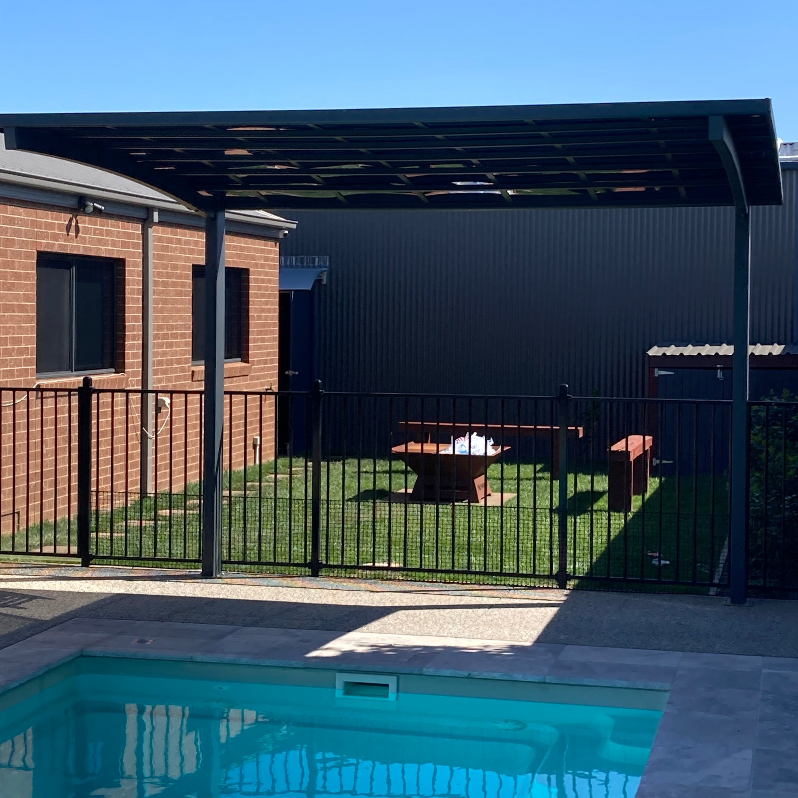 L Shape Cantilever Pergola installed over the pool